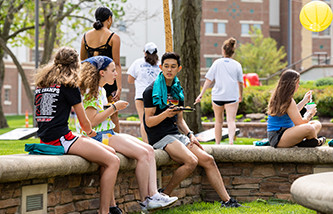 Students hanging out near the Firepit on campus